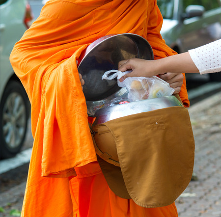 Buddhists have faith in Buddhism. giving alms to monks  receive almsの写真素材