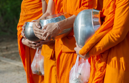 Buddhists have faith in Buddhism. giving alms to monks  receive almsの写真素材