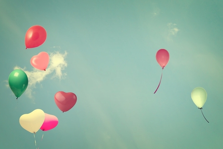 vintage heart balloon on blue sky concept of love in summer and valentineの写真素材