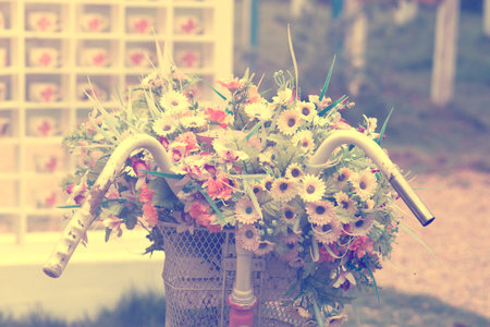 Detail of a Vintage Bicycle with Bouquet of flower, wedding decoration  (vintage color toned image)の写真素材