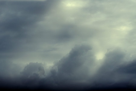 Rain cloud sky with sunbeam