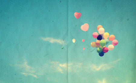 vintage heart balloon with colorful on blue sky concept of love in summer and valentine, wedding honeymoonの写真素材