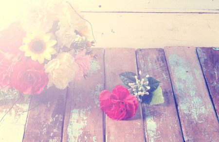Vintage flower on wooden with sun light in morningの写真素材