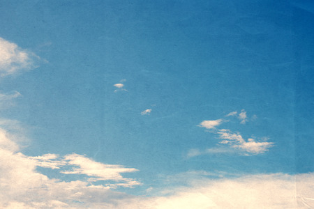 Sky with cloud vintage color toned paper textureの写真素材