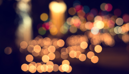 Lights blurred bokeh from christmas night party for your design, vintage or retro color toneの写真素材