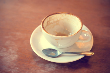 Empty coffee cup on the table in cafeの写真素材