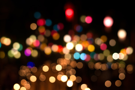 Lights blurred bokeh background from christmas night party for your design, vintage or retro color toneの写真素材