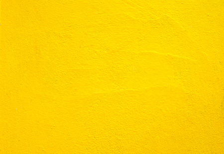 Concrete wall yellow color for texture backgroundの写真素材