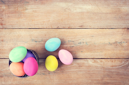 Vintage colorful easter eggs on wood table backgroundの写真素材