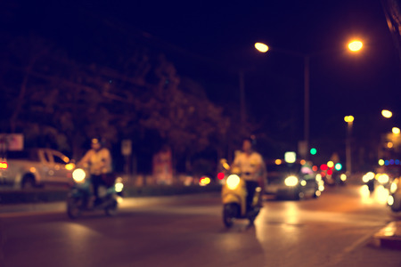 blurred background with bokeh of light from car on street at night,の写真素材