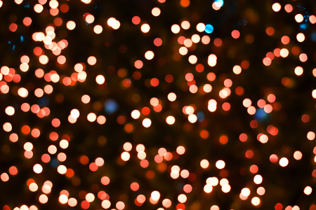 Lights blurred bokeh background from christmas night partyの写真素材