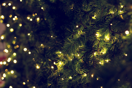 christmas tree on blurred background-vintage effectの写真素材