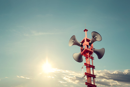 Horn speaker for public relations sign symbol, vintage color - sun with blue skyの写真素材