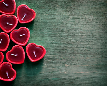 Red candle heart shape on blank wooden background. vintage color toneの写真素材