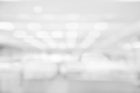 Abstract white and gray bokeh lights background with blurring lights for your designの写真素材