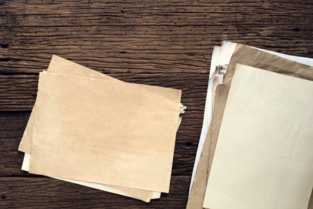 Empty old paper on wooden table - vintage background