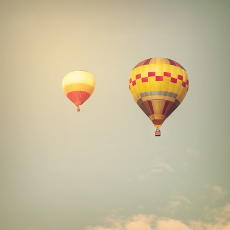 Hot air balloon on sun sky with cloud, vintage and retro filter effect styleの写真素材
