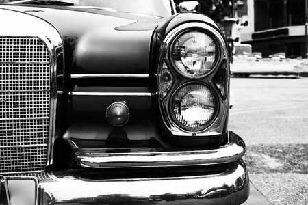 Black and white photo of classic car- vintage film grain filter effect stylesの写真素材