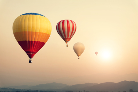 Hot air balloon on sun sky with cloud, vintage and retro filter effect styleの写真素材