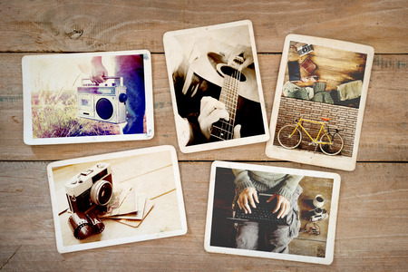 Photo album of hipster lifestyle journey trip in summer on wood table. instant photo of vintage camera - vintage and retro styleの写真素材