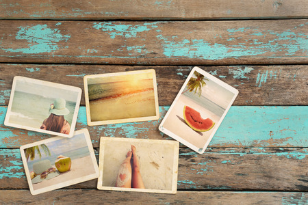 Photo album of journey honeymoon trip in summer on wood table. instant photo of vintage camera - vintage and retro styleの写真素材