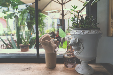 flower pot in cafe - decoration of coffee shop vintage style.の写真素材