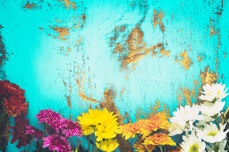 Colorful flowers bouquet on vintage wooden background, border design. vintage color tone - concept flower of spring or summer backgroundの写真素材