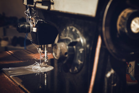 Old sewing machine. vintage color effect and dark tone.