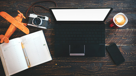 Business travel header background - travel accessories on wood table. vintage color toneの写真素材
