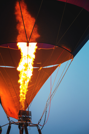 Close-up of hot air balloons with fire blue sky background applying retro and vintage filter effect styles.の写真素材