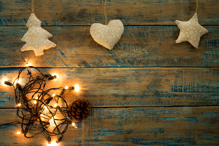 Christmas lights bulb with decoration on wood table. Merry christmas (xmas) background. topview, border design - rustic and vintage stylesの写真素材