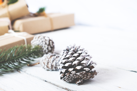 Christmas background - Craft and handmade Christmas present (gift boxes) and rustic decoration. Vintage style. Selective focus and shallow.の写真素材