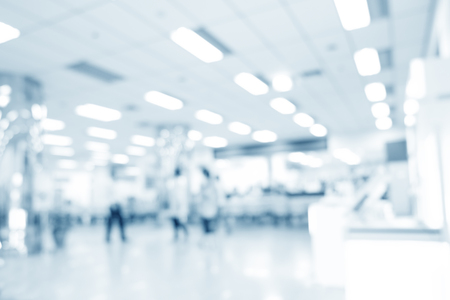 Blurred interior of hospital or clinical with people - abstract medical background.の写真素材