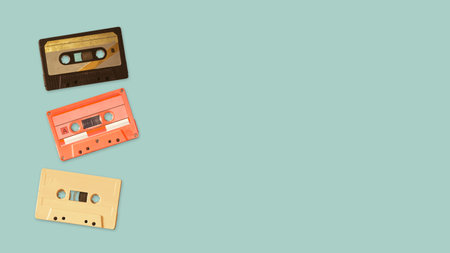 Tape cassette recorder on color background. retro technology. flat lay, top view hero header....