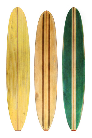 Vintage wood surfboard isolated on whiteの写真素材
