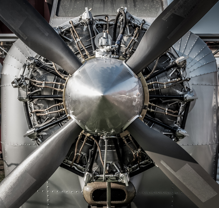 Close up vintage aircraft engine and propeller. HDR