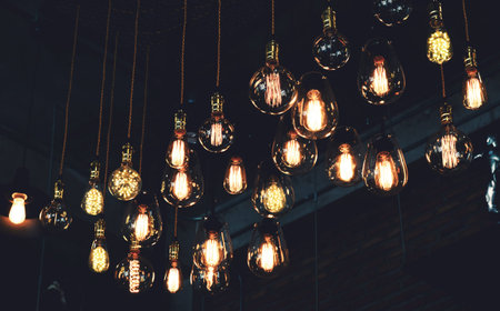 Beautiful vintage luxury light lamp hanging decor glowing in dark. Retro filter effect style.