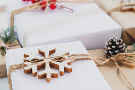Christmas handmade present with tag for Merry Christmas and New year holiday. Rustic craft gift boxes. vintage color tone image.の写真素材