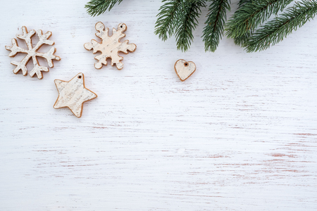 Christmas background - fir leaves and  rustic elements decorating on white wood table. Creative Flat layout and top view composition with border and copy space design.の写真素材