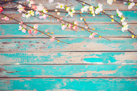 Cherry blossom flowers on vintage wooden background, border design. vintage color tone - concept flower of spring or summer backgroundの写真素材