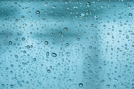 rain drops, water drops on glass in spring. abstract backgroundの写真素材