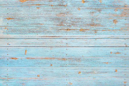 Vintage beach wood background - Old weathered wooden plank painted in turquoise or blue sea color.の写真素材