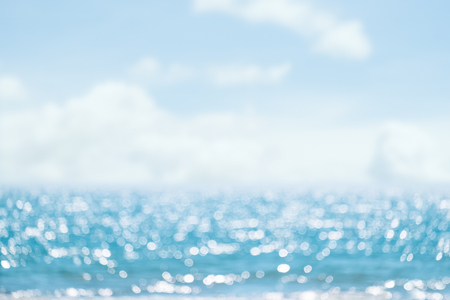 Seascape abstract beach background. blur bokeh light of calm sea and sky.の写真素材