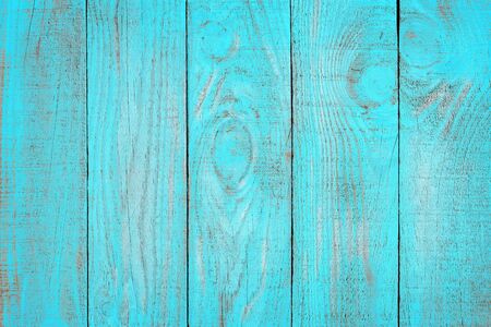Old weathered wooden plank painted in turquoise blue color. Vintage beach wood background.の写真素材