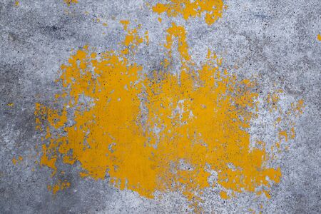Grunge concrete wall yellow color for texture backgroundの写真素材