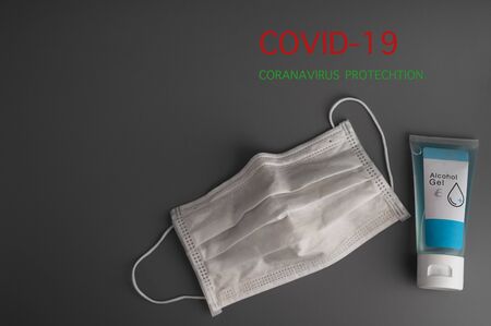 Coronavirus prevention masks and hand sanitizer gel to prevent pathogens from secretions and hand hygiene, corona virus spread protection. for medical surgical or travel.の写真素材