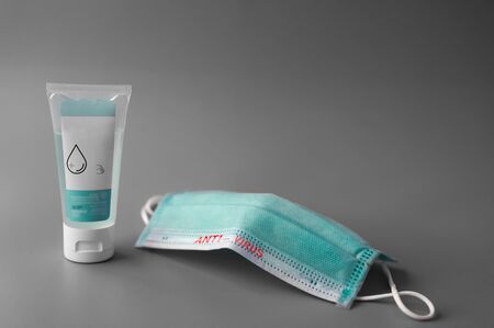 Coronavirus prevention masks and hand sanitizer gel to prevent pathogens from secretions and hand hygiene, corona virus spread protection. for medical surgical or travel.の写真素材