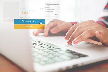 Woman stay at home and hand using laptop for online shopping. Online business marketing concept. の写真素材