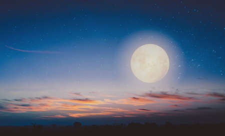 Full moon with star during twilight. Astronomy landscape in the summertime. nature background of amazing sky. retro color toneの写真素材