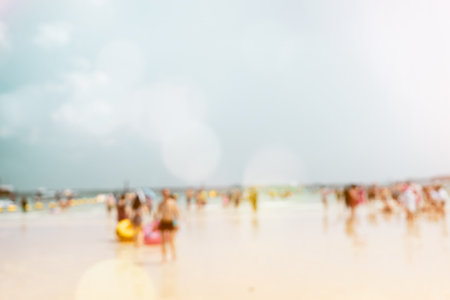 Abstract seascape blurred beach background. blur people on beach sea and sky. summertime vacation background concept. retro color effectの写真素材